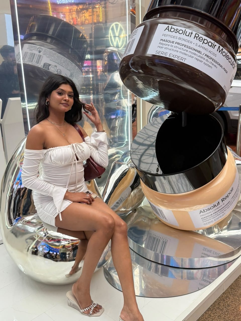 Vaishnavi Kadekar in a white off-shoulder dress at a L'Oréal Professionnel Absolut Repair installation